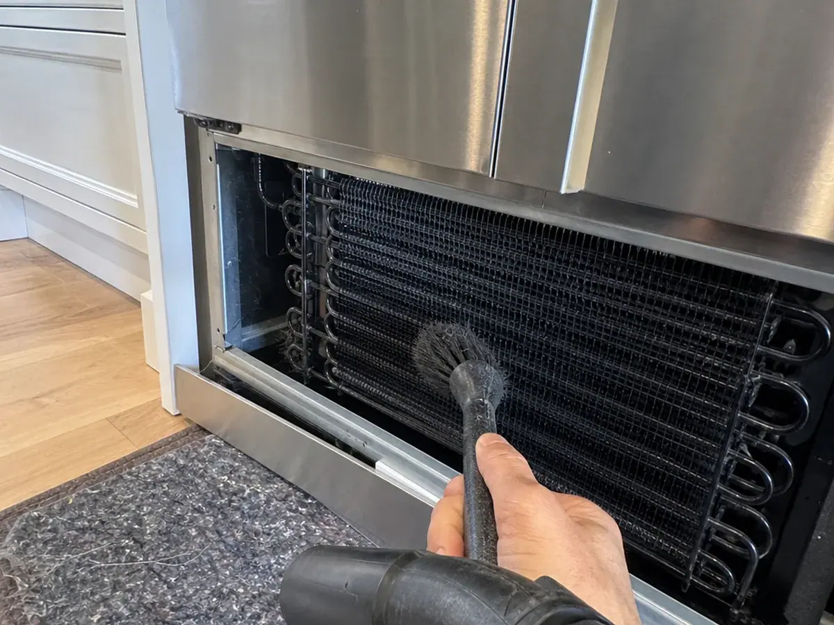 Novato Sub-Zero condenser coil cleaning and airflow check behind an open grille